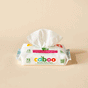 A pack of Caboo Baby Wipes on a beige background displays its white packaging with colorful text, featuring labels like MADE SAFE® certified and 72 Jumbo Wipes. A partially pulled-out wipe highlights the naturally derived and gentle touch of these bamboo wipes.