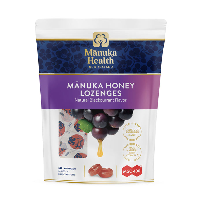 A pouch of Mānuka Health Mānuka Honey Lozenges, Natural Blackcurrant Flavor. The package shows blackcurrants, lozenges, and individually wrapped candies, with highlights of Delicious Relief and MGO 400+.