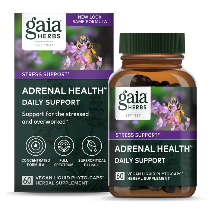 A box and bottle of Gaia Herbs Adrenal Health Daily Support, labeled for stress support. Both feature purple accents, flowers, and text highlighting vegan, liquid phyto-caps herbal supplement, 60 capsules.