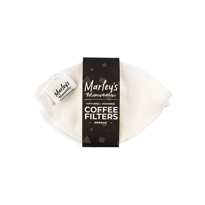 A set of white, reusable, washable organic coffee filters is packaged with a black label reading Marleys Monsters Coffee Filters.