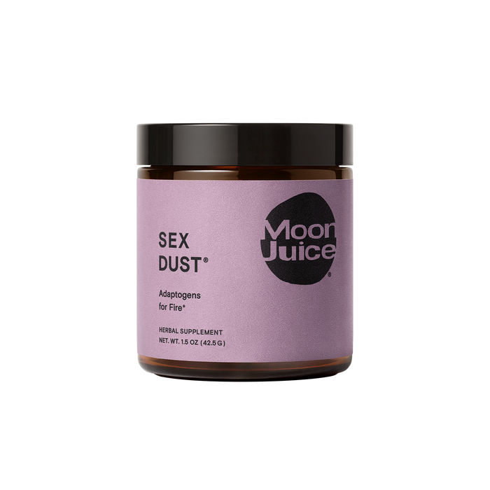 A brown glass jar with a purple label that reads “SEX DUST® Adaptogens for Fire* Moon Juice. Herbal Supplement. NET. WT. 1.5 OZ (42.5 G)” on a plain white background.