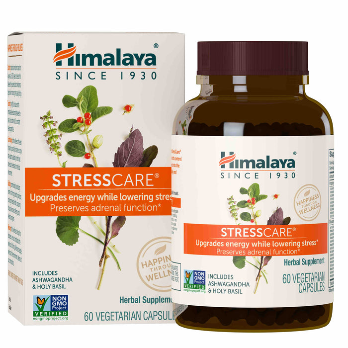 A bottle and box of Himalaya StressCare herbal supplement. The packaging features images of ashwagandha and holy basil leaves and roots, highlighting benefits like upgrading energy and lowering stress. Contains 60 vegetarian capsules.
