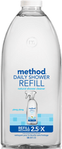 Method Daily Shower Refill, a clear plastic bottle, uses powergreen™ technology for effective cleaning. This natural ylang-ylang scented cleaner is vegan-friendly, featuring a spray bottle image on the label and offering a 2.5x larger refill size.