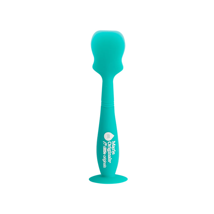 A teal-colored silicone spatula with a rounded top, a contoured handle for grip, and a suction cup base. The handle features white printed text and graphics. The spatula is upright on a white background.