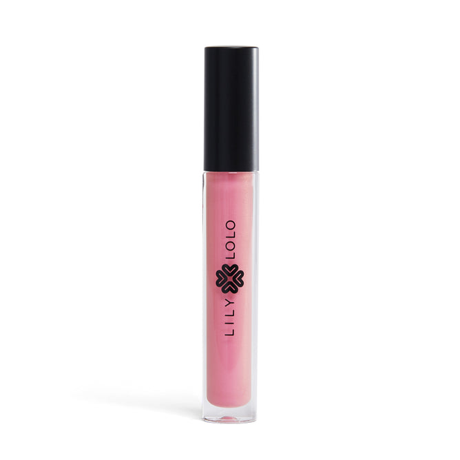 Lily Lolos Lip Gloss is a paraben-free, natural product in a clear tube with a black cap, showcasing pink gloss. The brand name and logo are vertically printed in black on the white background of the tube.