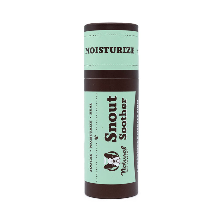 A cylindrical tube of Natural Dog Company Snout Soother with a mint green and brown label, designed to moisturize, soothe, and heal pets snouts.