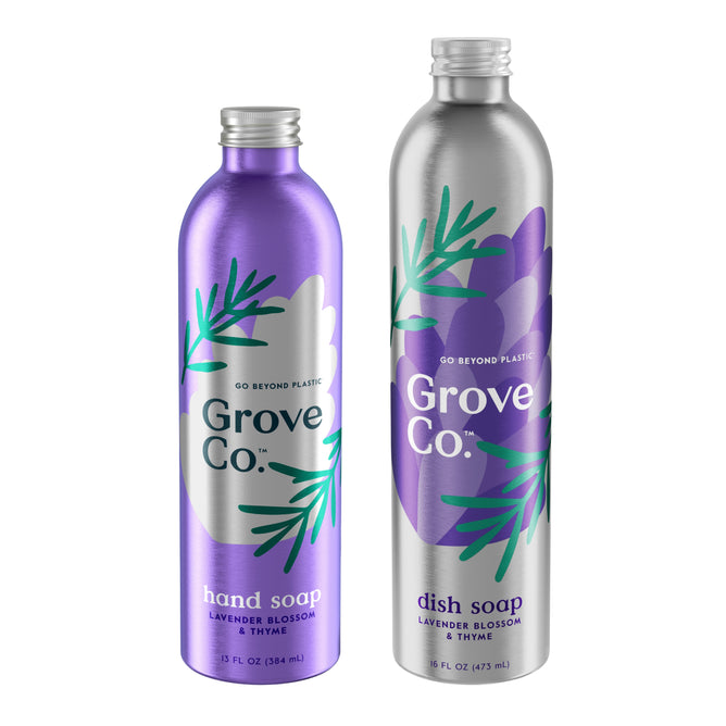 Two Grove Co. Hand & Dish Soap Refills feature plant graphics and the phrase Go Beyond Plastic: a purple bottle of hydrating hand soap in lavender blossom and thyme, and a silver dish soap bottle with a similar design, emphasizing zero plastic waste.
