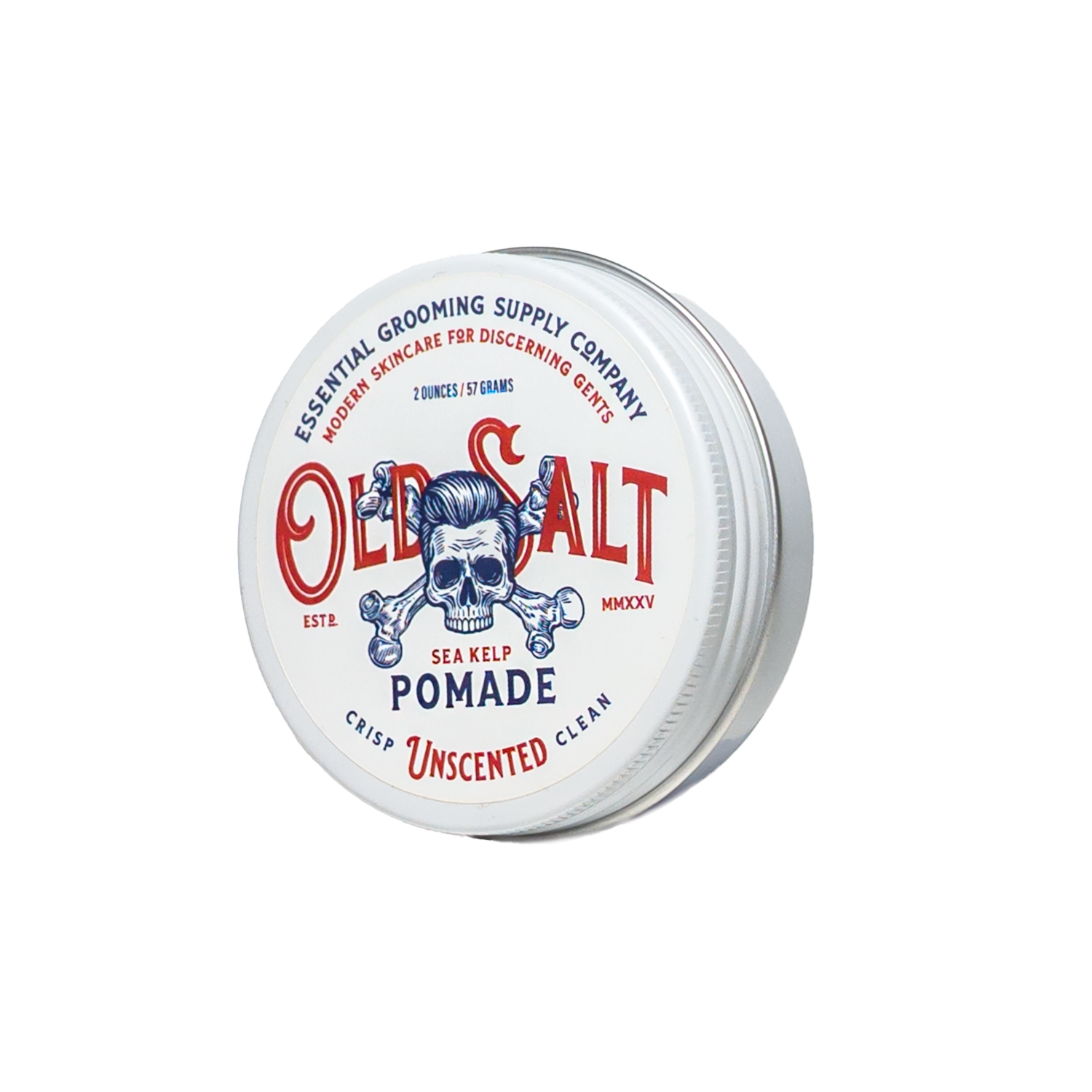 A round tin of Old Salt Pomade, a grooming essential with skull and anchor artwork. The unscented white container features crisp red and blue accents and is infused with sea kelp for a classic, clean touch.