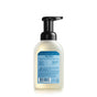 A clear plastic bottle of Mrs. Meyers Clean Day foaming hand soap with a black pump and a blue label displaying product information and usage instructions.