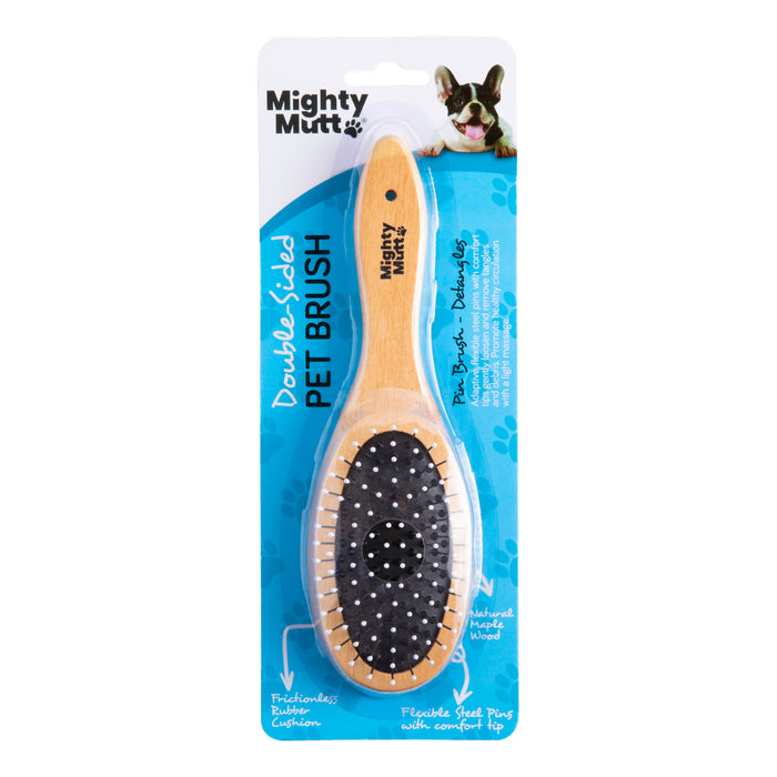 Mighty Mutt Double Sided Pet Brush in packaging, featuring a wooden handle and two grooming sides: one with metal bristles and one with softer bristles, designed for pets. A cartoon dog is shown in the top right corner.