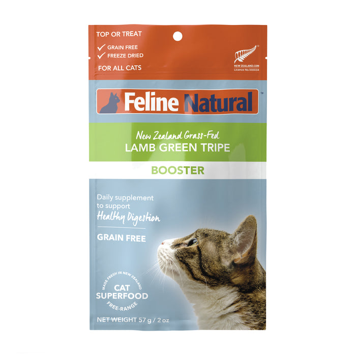 A package of Feline Natural Lamb Green Tripe Booster for cats, featuring a photo of a tabby cat looking up, and text highlighting that the product is grain free, freeze dried, and supports healthy digestion.