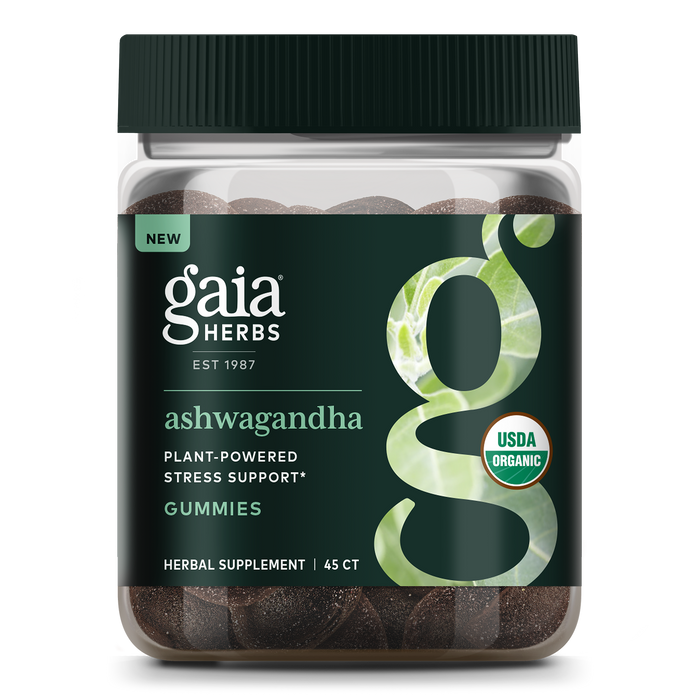A jar of Gaia Herbs Ashwagandha Gummies with a dark green label, large “g” design, and USDA Organic seal. The label notes plant-powered stress support and contains 45 herbal supplement gummies.
