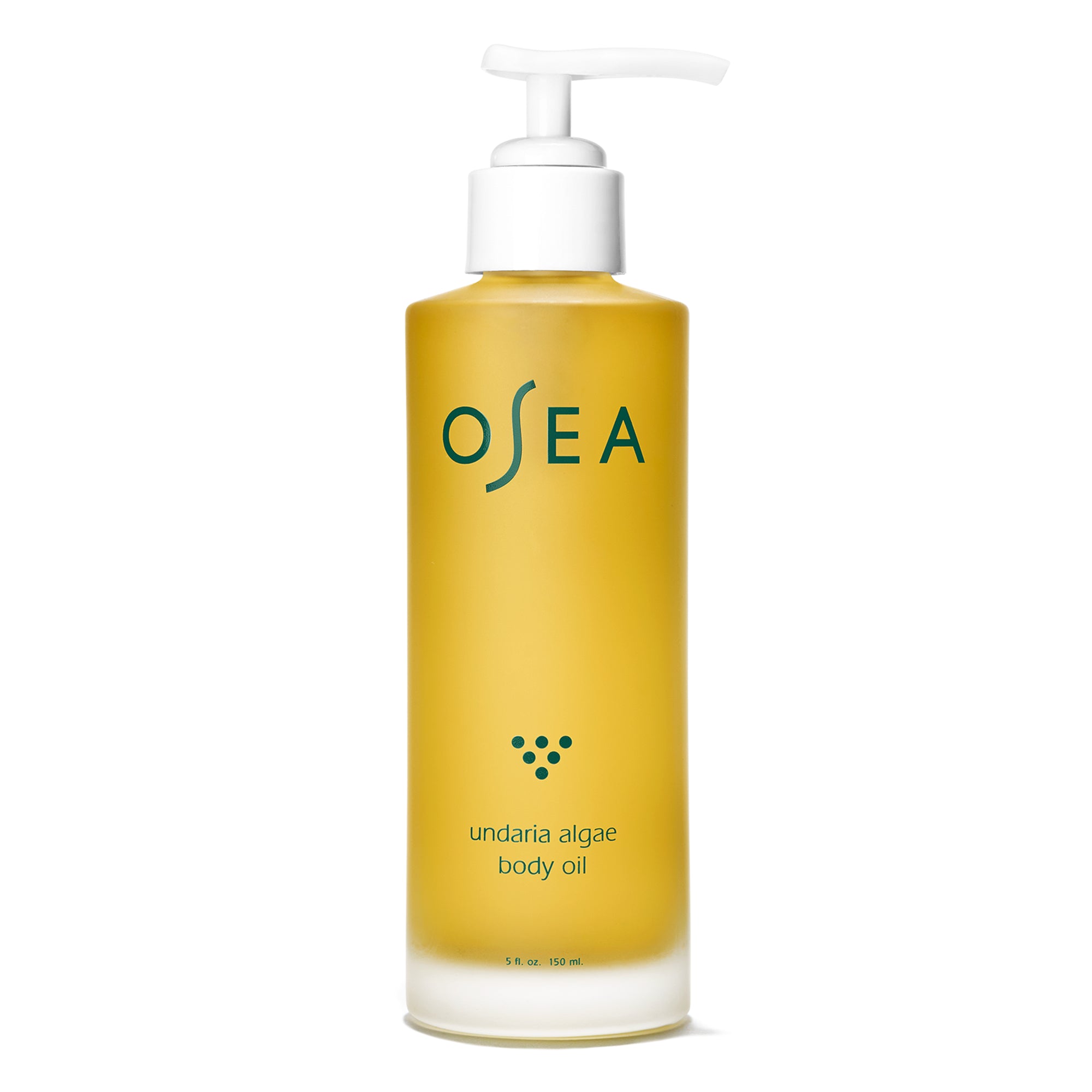 The OSEA Undaria Algae® Body Oil, in a clear 5 fl oz (150 mL) bottle with a white pump, features a OSEA label in green. It contains yellow oil for improved skin elasticity and deep moisturization, with undaria algae body oil printed below green dots.