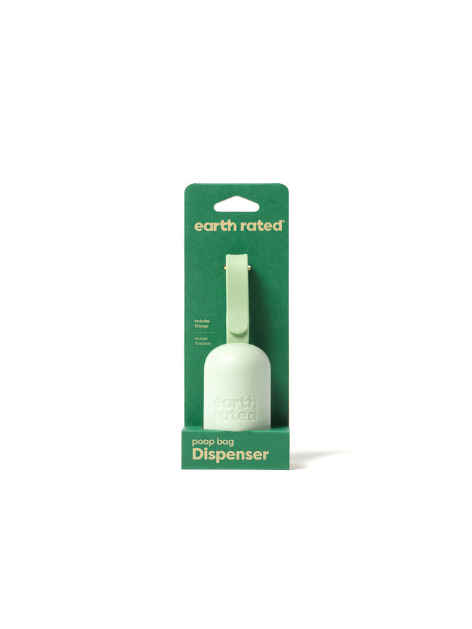 The Earth Rated Dog Leash Dispenser is a green poop bag holder made from recycled plastic. It features a hook, textured grip for easy leash or bag attachment, and is packaged on matching cardboard backing.
