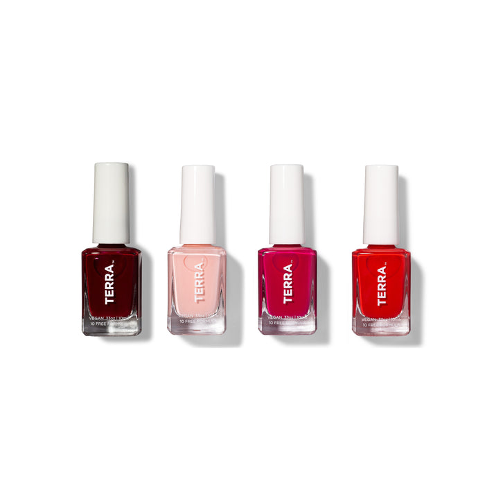 Four bottles of TERRA nail polish in varying shades—dark red, light pink, bright fuchsia, and classic red—are arranged in a row on a white background.