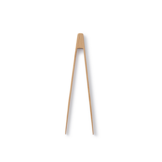 A single piece of light-colored wood carved into a pair of connected chopsticks, expanding at the top and tapering to pointed tips, set against a white background.