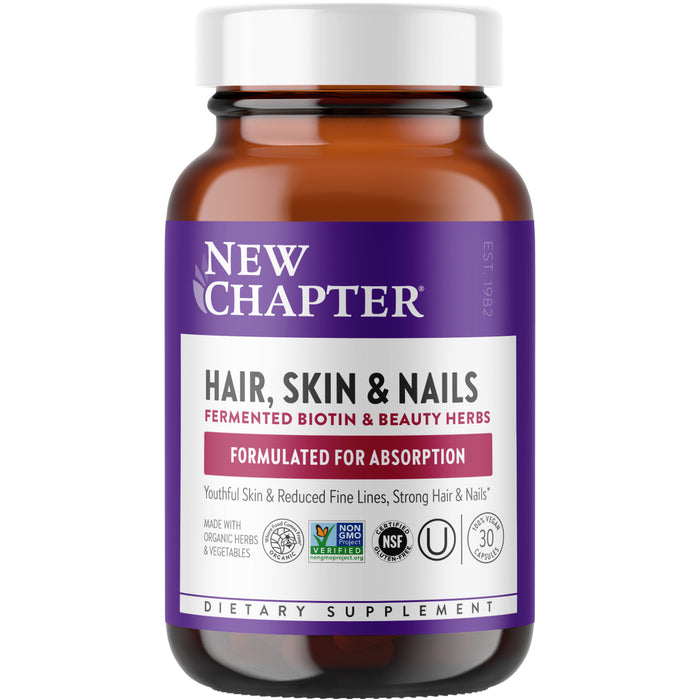 A brown bottle of New Chapter Hair, Skin & Nails dietary supplement with a purple and white label highlighting fermented biotin, beauty herbs, and benefits for youthful skin, reduced fine lines, and strong hair and nails.