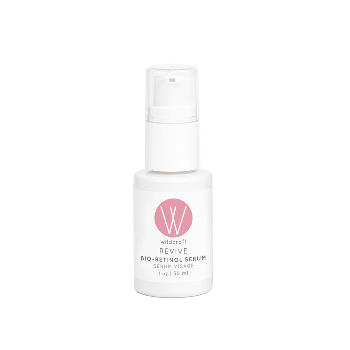 A white bottle of Wildcraft Revive Bio-Retinol Serum with a clear pump cap and a pink circular logo on the front, containing 1 oz (30 ml) of product.