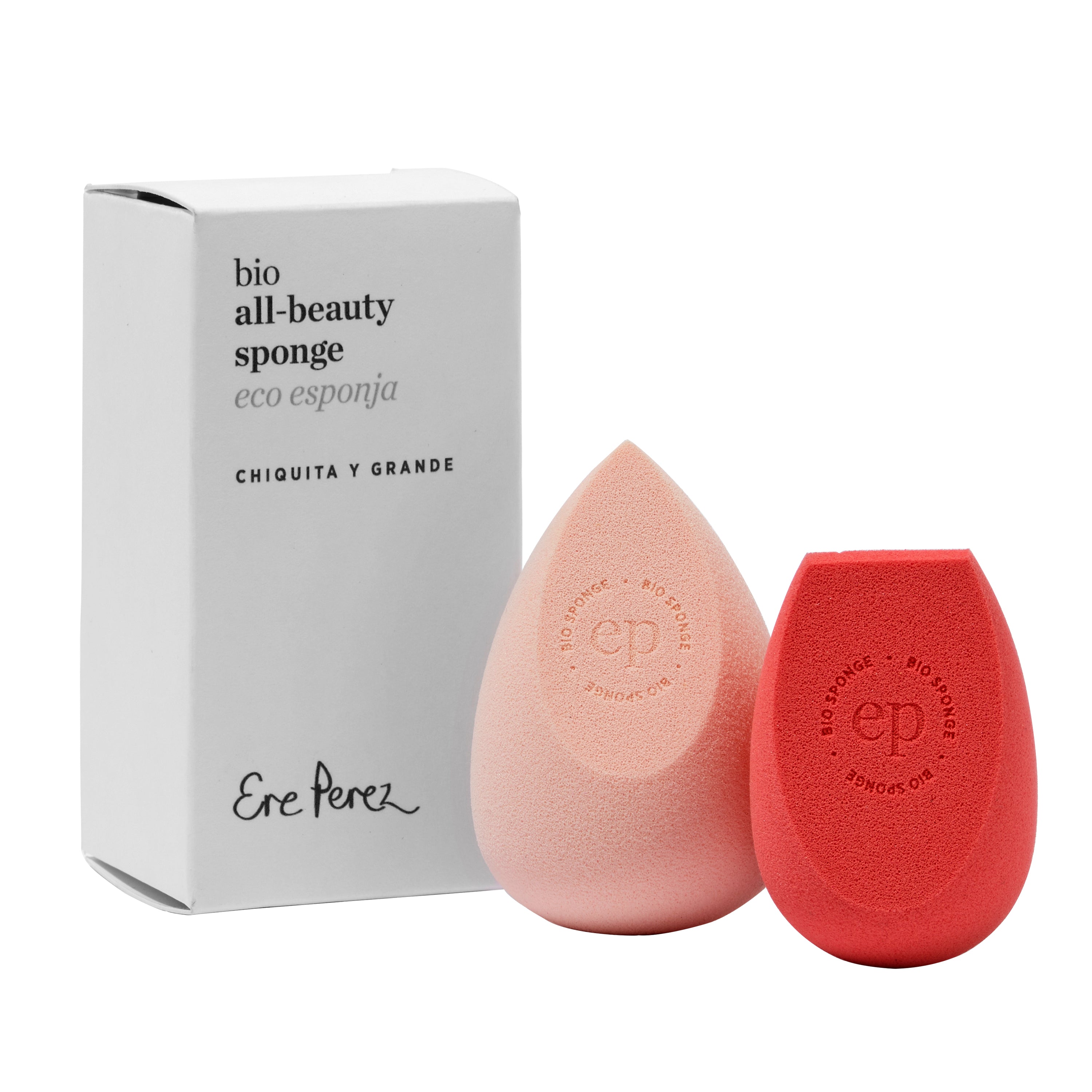 Two pink and coral drop-shaped beauty sponges with ep and eco sponge embossed on them ensure seamless makeup application. The Ere Perez Bio All-Beauty Sponge set includes a white box labeled bio all-beauty sponge, eco esponja, chiquita y grande for sustainable beauty.