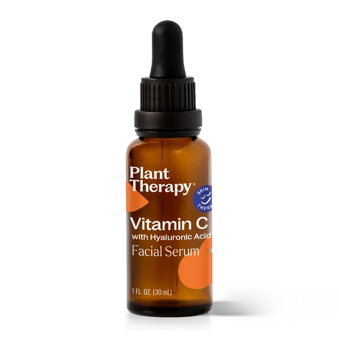 A 1 fl oz (30 ml) amber glass dropper bottle of Plant Therapy Vitamin C with Hyaluronic Acid Facial Serum stands upright against a white background.
