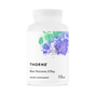 A white bottle of Thorne Basic Nutrients 2/Day daily multivitamin featuring abstract green and purple artwork on the label; contains 120 capsules.