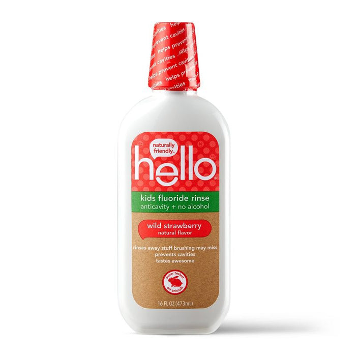 A white bottle of Hello brand kids fluoride rinse in wild strawberry flavor, featuring a red label and cap, with text promoting its anticavity benefits and alcohol-free formula. The bottle contains 16 fl oz (473 mL).