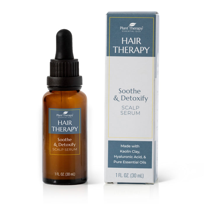 A brown glass dropper bottle and its box labeled Plant Therapy Hair Therapy Soothe & Detoxify Scalp Serum, featuring ingredients like kaolin clay, hyaluronic acid, and pure essential oils.