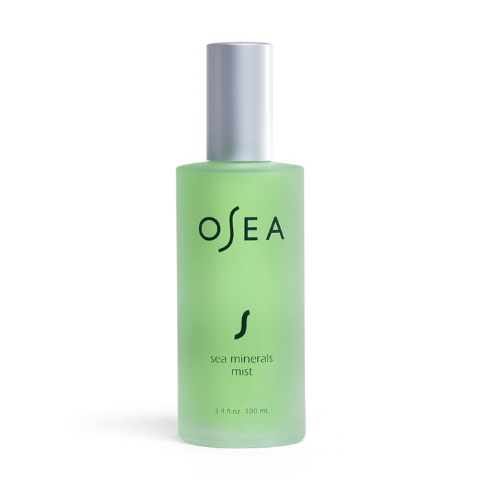 A frosted green bottle of OSEA Sea Minerals Mist with a silver cap. The label displays the brand name “OSEA” in black text, along with the product name and volume, 3.4 fl oz / 100 ml.
