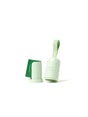 A light green, cylindrical dispenser with a loop handle and the words earth rated embossed on it, next to a matching cap and a roll of green waste bags.