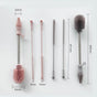 Five silicone cleaning brushes of varying sizes and colors are aligned vertically, each with metal handles and measuring labels indicating widths and lengths in millimeters.