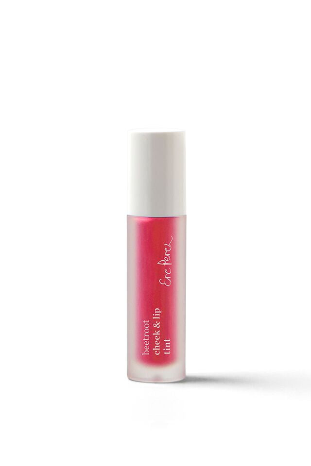 A small bottle of bright pink cheek and lip tint with a white cap and white text on the bottle, standing upright on a white background.