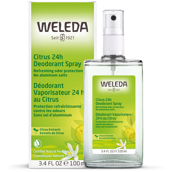 A bottle of Weleda Citrus 24h Deodorant Spray sits in front of its matching box. The packaging is white and green with yellow accents and labeled in English and French. The bottle contains 3.4 fl oz (100ml).