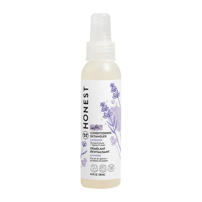 A white spray bottle of Honest Conditioning Detangler in Lavender scent, featuring a clear cap and purple botanical illustrations on the label. The bottle contains 4 fl oz (118 mL) of product.