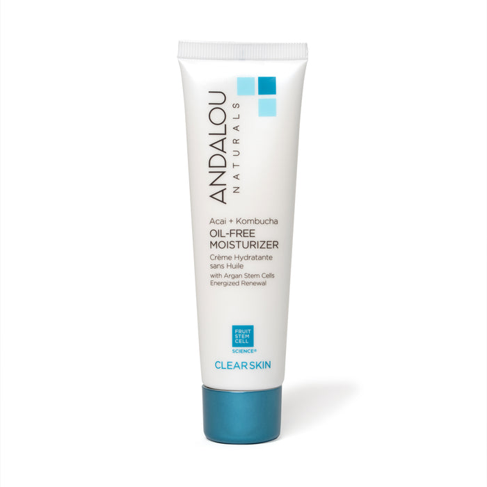 A white tube of Andalou Naturals Oil-Free Moisturizer with blue accents, labeled Acai + Kombucha, designed for clear skin. The tube stands upright and displays product details in English and French.