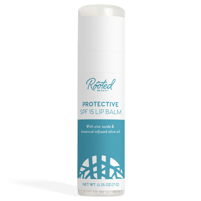A white tube of Rooted Beauty Protective SPF 15 Lip Balm with blue accents and text, featuring zinc oxide and botanical-infused olive oil. The net weight is 0.25 oz (7g).