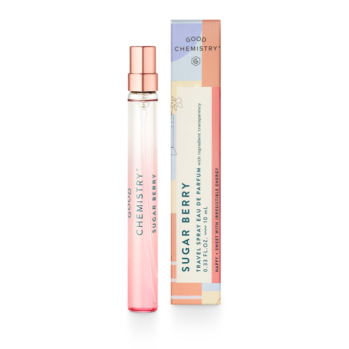 A pink ombré perfume spray bottle labeled Good Chemistry Sugar Berry stands next to its colorful, rectangular packaging, which features the same name and describes it as a travel spray eau de parfum.