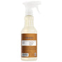 A spray bottle of Mrs. Meyer's Multi-Surface Cleaner with a white nozzle and brown label, featuring product details and essential oils on the back.