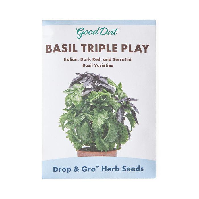 A seed packet labeled Good Dirt BASIL TRIPLE PLAY: Italian, Dark Red, and Serrated Basil Varieties with an image of a potted basil plant on the front. Text at the bottom reads Drop & Gro Herb Seeds.