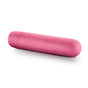 A single large, pink capsule with a smooth surface, resting horizontally against a white background, slightly speckled in texture. Resembling the innovative design of the Blush Gaia Eco Bullet, it hints at its nature as a sustainable sex toy.