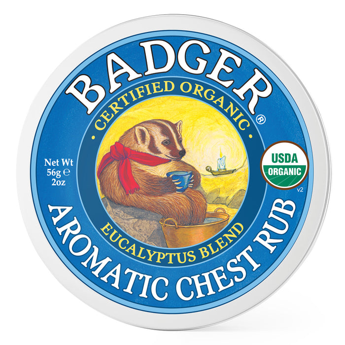 Round tin of Badger Aromatic Chest Rub with a drawing of a badger holding a steaming cup, red scarf around its neck, and the text Certified Organic Eucalyptus Blend and USDA Organic on the label.