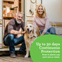 A smiling couple poses with a golden retriever on the porch of a trailer. The man has gray hair and wears a brown sweater, while the woman has blonde hair and wears a pink shirt. A green circle reads, "Up to 30 days Continuous Protection.