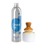 A silver bottle of Grove Co. Dish Washing Starter Set’s Ultimate Dish Soap, Free & Clear, sits beside a wooden dish brush with bristles in a white holder, featuring blue circular designs that highlight Grove Co.s pledge to cut plastic waste.