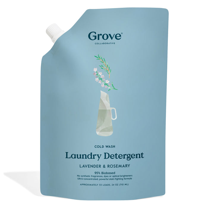 A blue, standing pouch of Grove Collaborative Cold Wash Laundry Detergent in Lavender & Rosemary scent, featuring a simple illustration of a vase with flowers on the front. The package states it contains 24 oz for 33 loads.