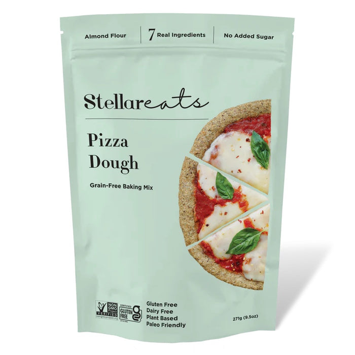A light green package of Stellareats Pizza Dough Grain-Free Baking Mix, featuring a photo of a sliced pizza with tomato sauce and basil. The packaging highlights Gluten Free, Dairy Free, Plant Based, and Paleo Friendly.
