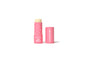 A pink tube of Axiology vegan lip balm with the cap off and placed to the right, revealing the balm stick. The packaging features white text and small triangle patterns.
