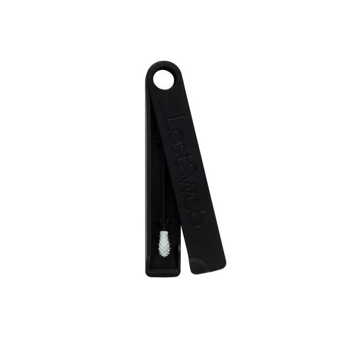 The black plastic LastSwab Original Reusable Swab by LastObject, designed like eco-friendly ear cleaners, includes a small brush head inside a rectangular case. The case features a top hole and LastSwab on the side, exemplifying its sustainable use akin to reusable cotton swabs.