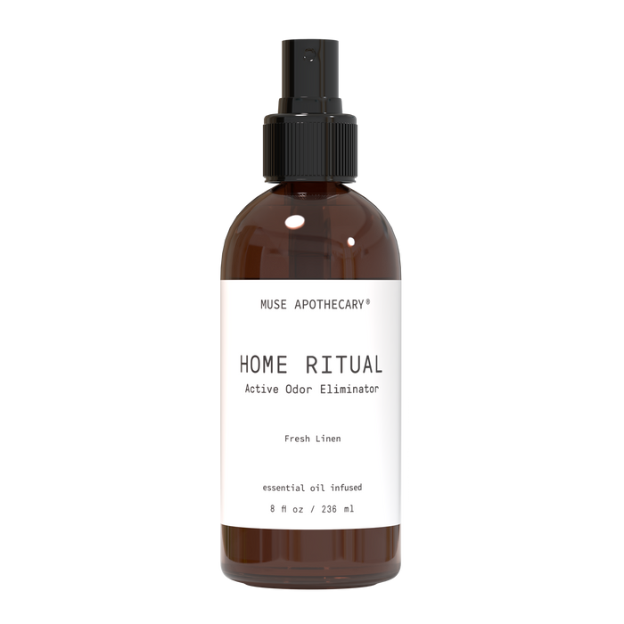 A brown spray bottle labeled Muse Apothecary Home Ritual Active Odor Eliminator with Fresh Linen scent, containing 8 fl oz (236 ml) of essential oil infused product, against a plain background.