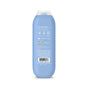A blue bottle of shampoo shown from the back, displaying white text, symbols, and a barcode near the bottom, with a translucent cap on top.