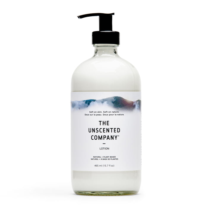 A clear pump bottle of The Unscented Company lotion with a white label and minimalistic design, containing 465 ml (15.7 fl oz). The label notes it is natural, plant-based, and unscented.