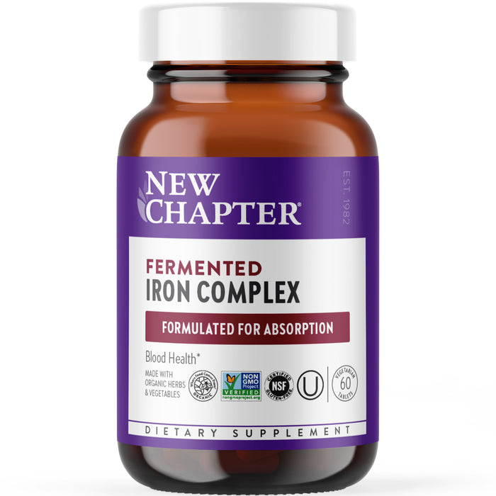A brown bottle of New Chapter Fermented Iron Complex dietary supplement with a purple and white label, featuring icons for non-GMO, organic, NSF certified, vegan, and 60 tablets.